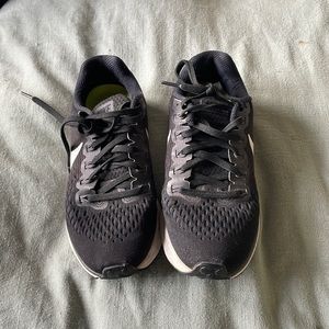 Women’s black and white Nike sneakers